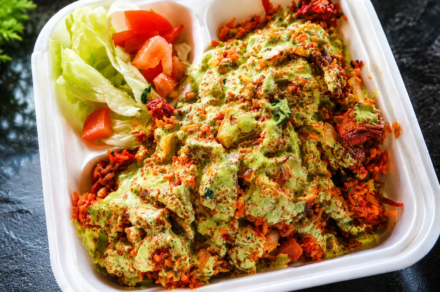 Chicken with cilantro sauce over rice