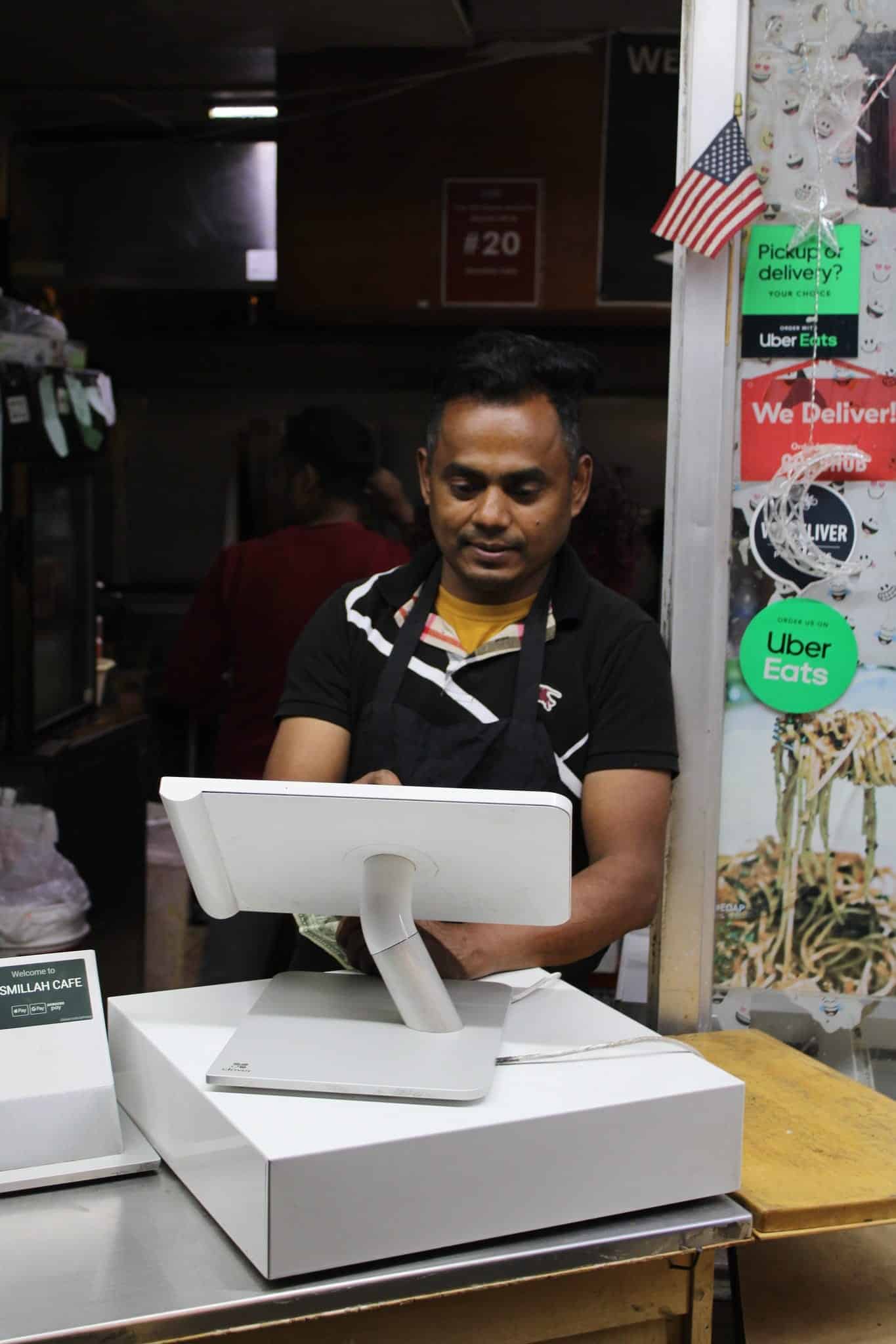 Nowshed Hossain, founder of Bismillah Cafe, at the register